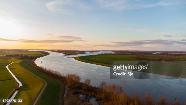 delta of the river ijssel in overijssel during sunset after a beautiful winter day - netherlands stock pictures, royalty-free photos & images