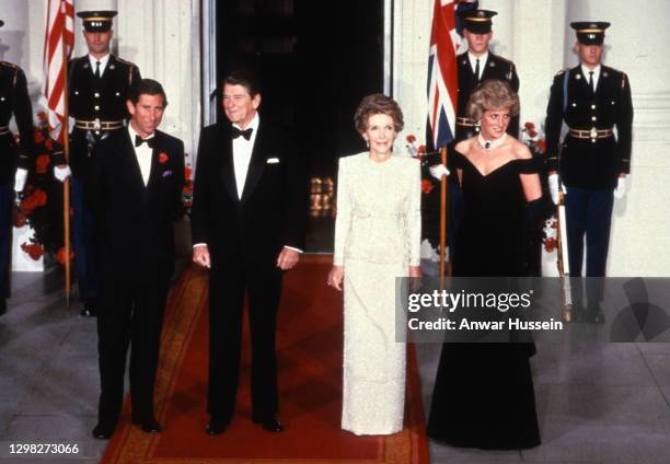 Prince Charles, Prince of Wales and Diana, Princess of Wales , wearing a midnight blue velvet, off the shoulder evening gown designed by Victor...