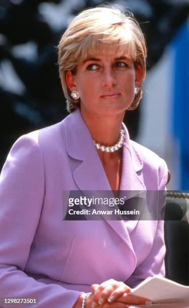 Diana, Princess of Wales, wearing a lilac suit, attends an anti-landmines press briefing at the Red Cross headquarters on June 17, 1997 in...