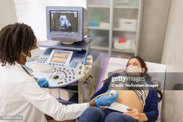 ultrasound examination - foetus stock pictures, royalty-free photos & images