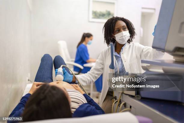 ultrasound examination - x-ray technician stock pictures, royalty-free photos & images