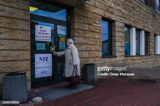 An elderly woman arrives to be given a Pfizer/BioNTech COVID-19 jab at the Krakow University Hospital on January 25, 2021 in Krakow, Poland. Today,...