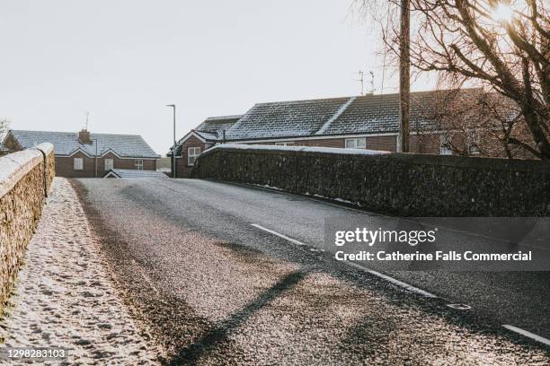 small country road bridge covered in a light frost - car crash wall stock pictures, royalty-free photos & images