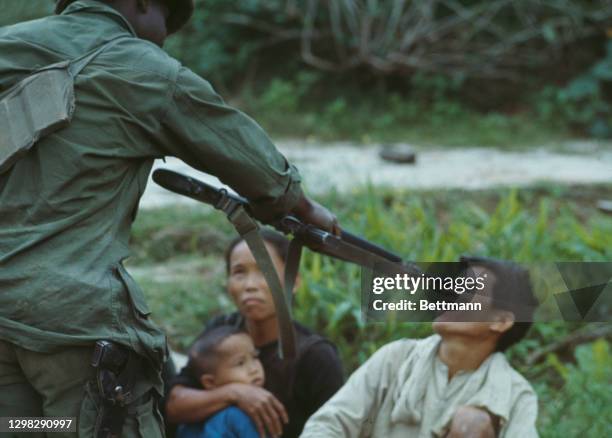 Captured Viet Cong prisoners as United States troops continue to search the area, during the Vietnam War, in southern Vietnam, 2nd April 1968. The US...