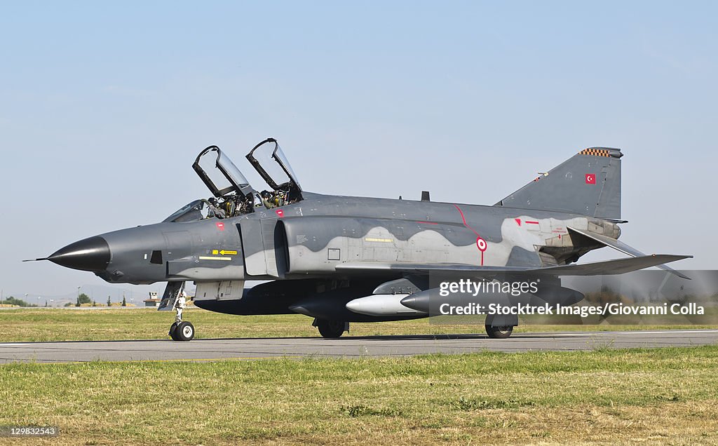 A Turkish Air Force RF-4E taxiing at Izmir Air Base during the Izmir Air Show 2011 in Turkey, celebrating 100 years of the Turkish Air Force.