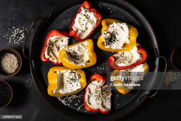 bell peppers and cream cheese, popular snack - stuffing photos et images de collection