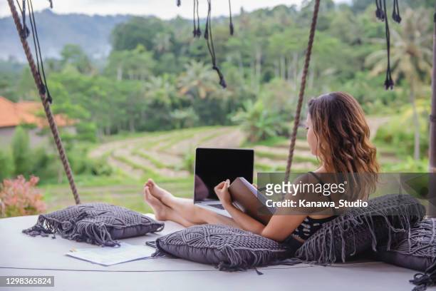 chinese millenials woman writing on her journal - time off work stock pictures, royalty-free photos & images