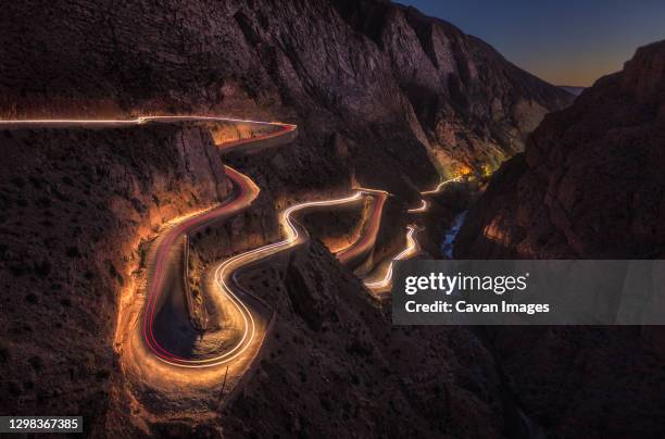 a gorge carved by the dades river separates atlas and anti-atlas - atlas maroc stock pictures, royalty-free photos & images