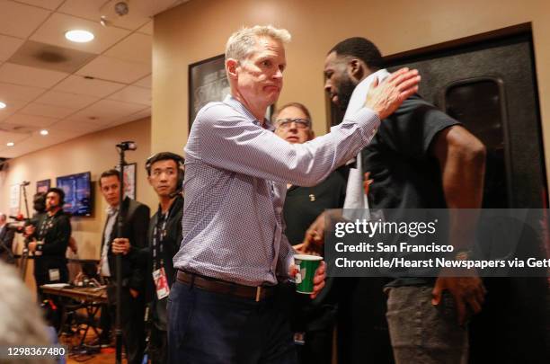 Golden State Warriors head coach Steve Kerr greets Draymond Green after his postgame press conference for game 6 of the NBA Finals between the Golden...