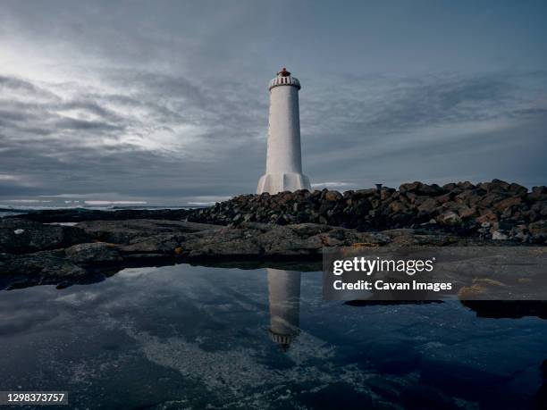 lighthouse against gray cloudy sky - akranes bildbanksfoton och bilder