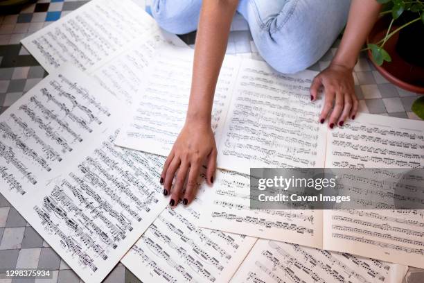 young girl musician reading her scores. - association of religion data archives stock pictures, royalty-free photos & images