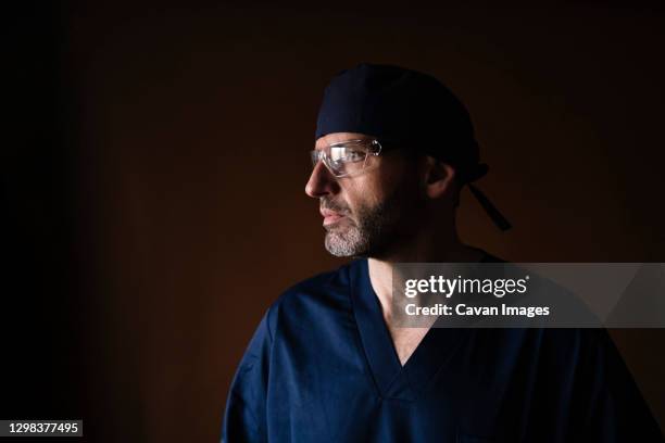 portrait of a middle-aged male doctor - dental office bildbanksfoton och bilder