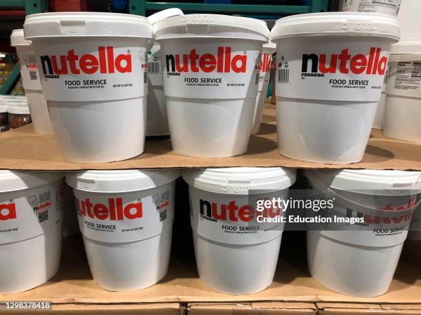 Stacked large tubs of Nutella spread in Costco.