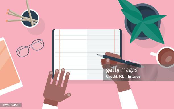 flat vector illustration of person writing in notebook at desk - personal organizer stock illustrations
