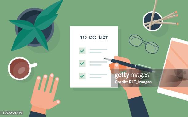 flat vector illustration of person checking to do list at desk - writer stock illustrations