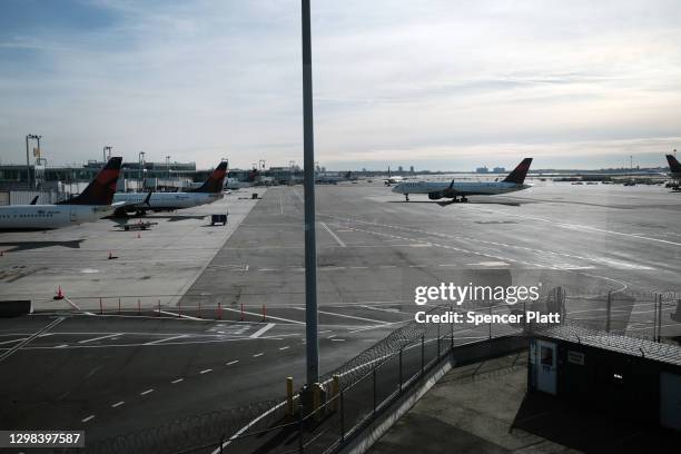 Plane sits on a tarmac at an international terminal at John F. Kennedy Airport on January 25, 2021 in New York City. In an effort to further control...