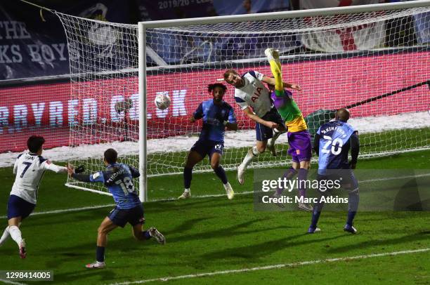 Harry Kane of Tottenham Hotspur and Ryan Allsop of Wycombe Wanderers compete in the air during The Emirates FA Cup Fourth Round match between Wycombe...