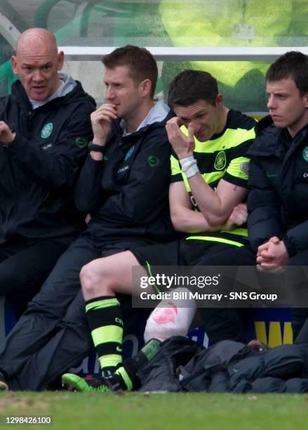 Celtic's Robbie Keane wears an ice pack on his knee after picking up a knock