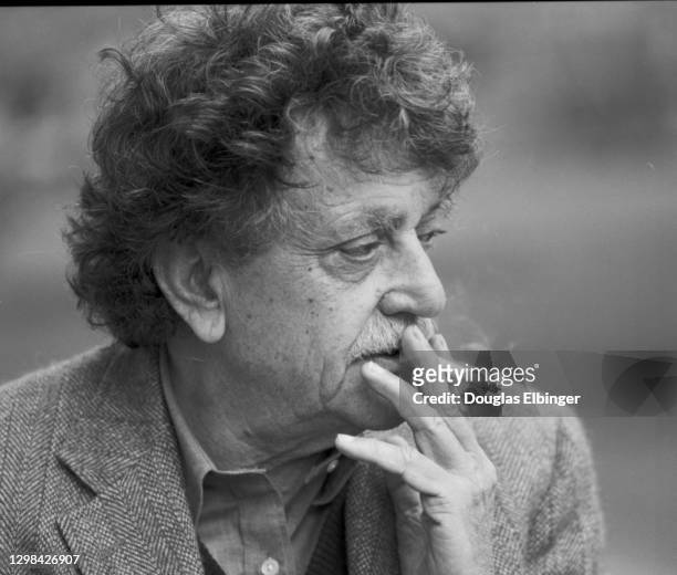 View of American author Kurt Vonnegut Jr as he smokes a cigarette outside the Michigan State University Student Union, East Lansing, Michigan, April...