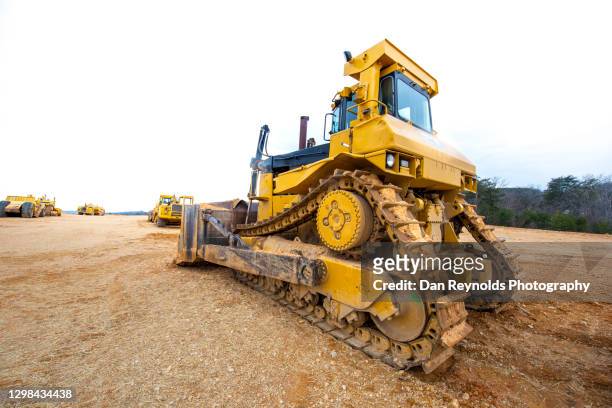 construction bulldozer aginst white sky hdr - hdri background stock pictures, royalty-free photos & images
