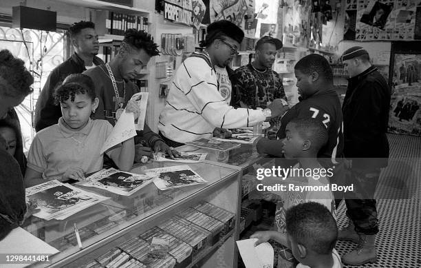 Rapper Rakim and DJ Eric B. Of Eric B. & Rakim signs autographs and greets fans at Barney's One Stop in Chicago, Illinois in April 1990.