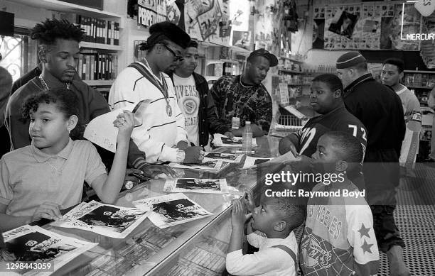 Rapper Rakim and DJ Eric B. Of Eric B. & Rakim signs autographs and greets fans at Barney's One Stop in Chicago, Illinois in April 1990.