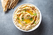 Healthy Homemade Creamy Hummus with Olive Oil and Pita Chips