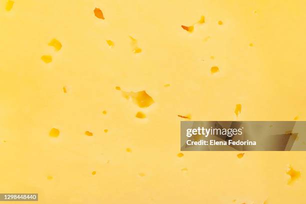 dutch cheese texture. - cheddar cheese stock pictures, royalty-free photos & images