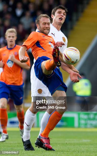 V AALESUNDS FK.FIR PARK - MOTHERWELL.Aalesund's Trond Fredriksen is closed down by John Sutton