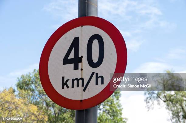 40 kilometer per hour speed limit sign - speed limit sign stock pictures, royalty-free photos & images