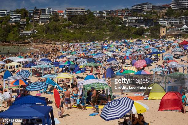 Huge crowds flock to cool off at Freshwater Beach on January 26, 2021 in Sydney, Australia. The Bureau of Meteorology has forecast severe heatwave...