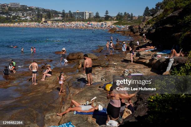 People are seen cooling off at Freshwater Beach on January 26, 2021 in Sydney, Australia. The Bureau of Meteorology has forecast severe heatwave...