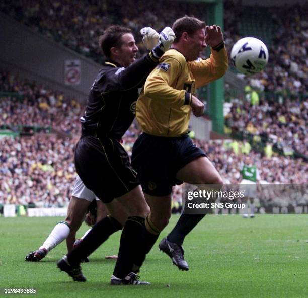 Hibs keeper Nick Colgan clatters into Alan Thompson to concede a penalty