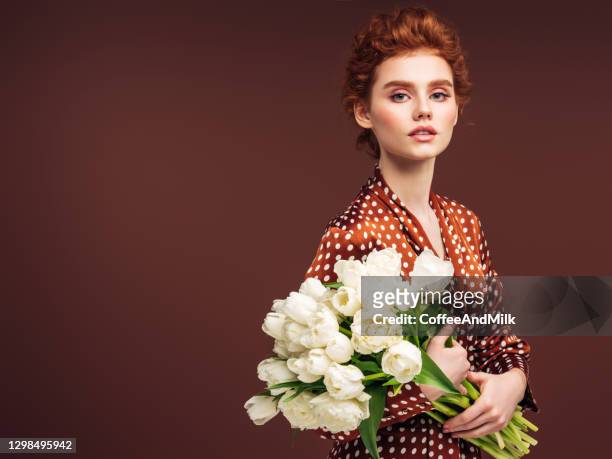 beautiful woman with a bouquet of flowers - brown dress stock pictures, royalty-free photos & images