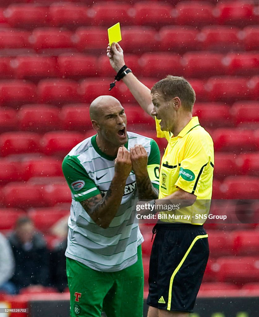 07/08/11 CLYDESDALE BANK PREMIER LEAGUE.ABERDEEN v CELTIC (0-1).PITTODRIE - ABERDEEN.Celtic's Daniel Majstorovic is cautioned by referee Calum Murray. (Photo by Bill Murray\SNS Group via Getty Images)