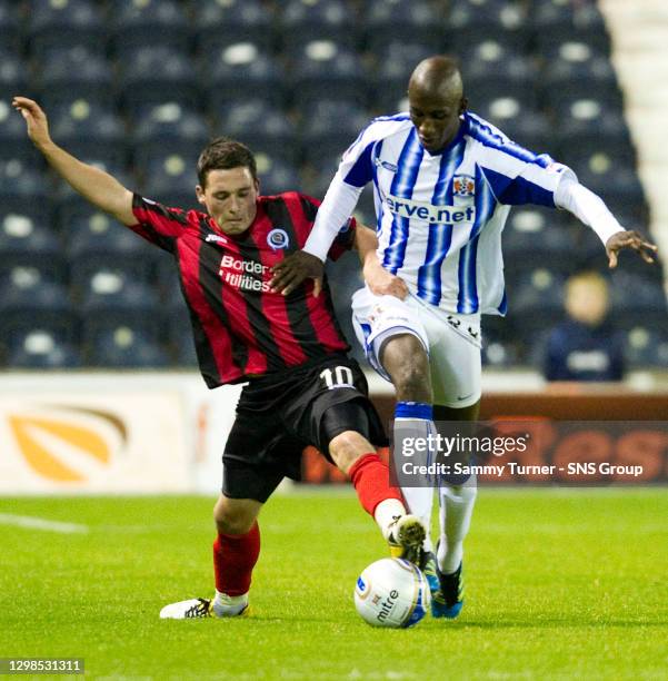 V QUEEN OF THE SOUTH.RUGBY PARK - KILMARNOCK.Queen of the South's Nicky Clark challenges Momo Sissoko