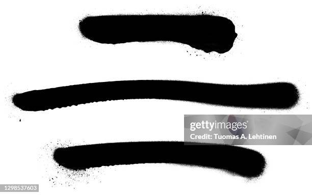 close-up of three black spray paint lines, isolated on white background. - spray-de-tinta imagens e fotografias de stock
