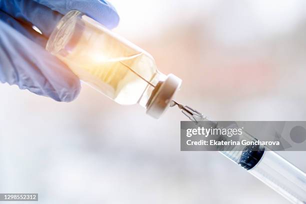 magical vaccine vial dose flu shot drug needle syringe,medical concept vaccination hypodermic injection treatment disease care hospital prevention immunization illness disease baby child. - medical injection stock pictures, royalty-free photos & images