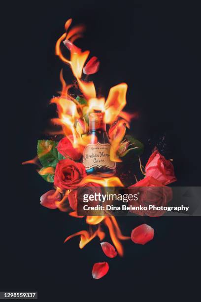 broken heart cure, magical potion, roses and fire, valentine's day concept - wicca stock-fotos und bilder