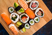 Fresh sushi selection on wooden board