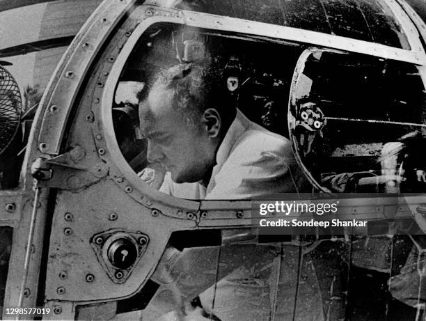 Former Indian Prime Minister Rajiv Gandhi in the cockpit of a helicopter during 1991 election campaigning. Rajiv Gandhi was a pilot by profession and...