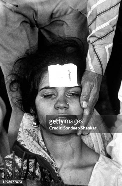 Man consols his wife at Hameedia Hospital in Bhopal on December 04, 1984. Immediate death toll of 2259 and thousands with severe and permanently...