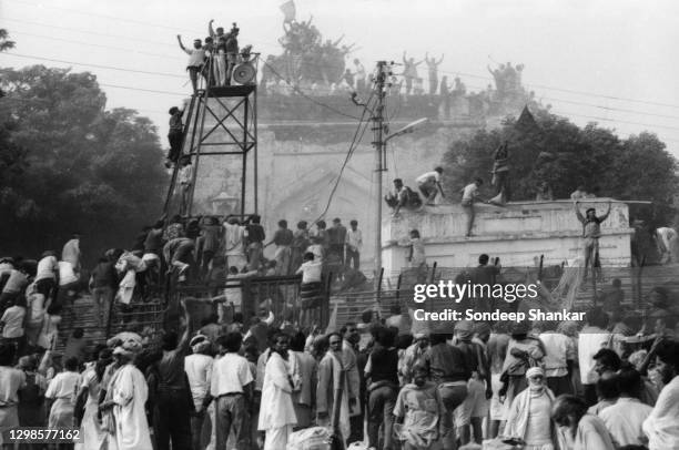 Hindu fundamentalists climb the dome of Babri Masjid in Ayodhya to demolished the structure on December 06, 1992. The 16th century Babri Mosque...