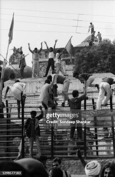 Hindu fundamentalists climb the dome of Babri Masjid in Ayodhya to demolished the structure on December 06, 1992. The 16th century Babri Mosque...