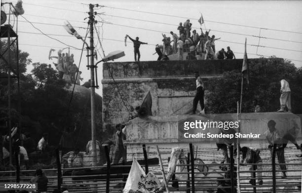 Hindu fundamentalists climb the dome of Babri Masjid in Ayodhya to demolished the structure on December 06, 1992. The 16th century Babri Mosque...