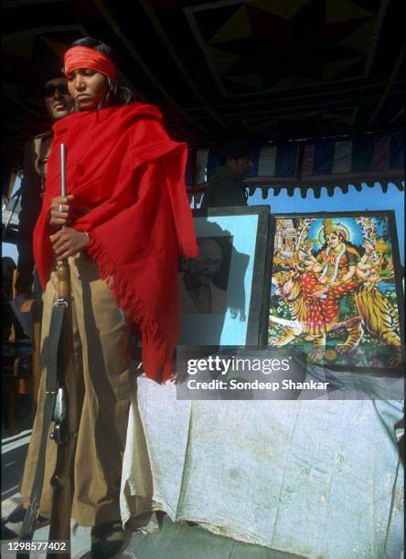 "Bandit queen" Indian rights activist, bandit and politician Phoolan Devi with her gun surrenders at a ceremony at Bhind, Madhya Pradesh