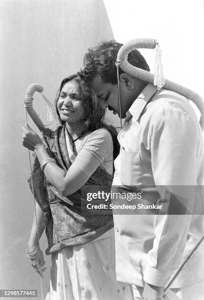 Indian politician Phoolan Devi , once a notorious bandit popularly known as the 'bandit queen' with her husband Umaid Singh carrying a bow and arrow,...
