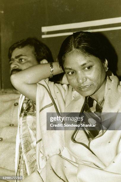 Indian politician Phoolan Devi , with husband Umaid Singh,address a press conference at the Press Club of India on January 14, 1995 in New Delhi,...