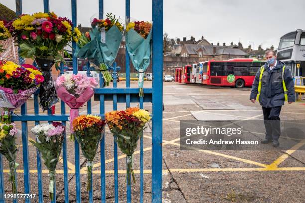 Tributes are left on the railings of Lewes Road Bus Garage in memory of bus driver Christopher Turnham who died of COVID-19 last Wednesday at the age...