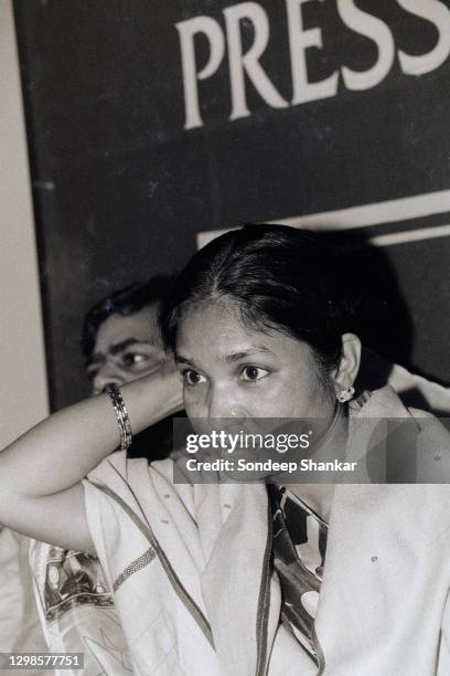 Phoolan Devi with husband Umaid Singh address a press conference at the Press Club of India on January 14, 1995 in New Delhi, India, before launching...